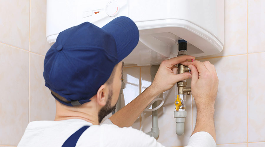 plumber installing a water heater tracy ca